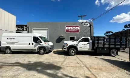 EDCO building with two EDCO trucks in front of it